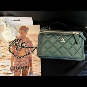Chanel Vanity Bag with handle and Mirror in dark green.